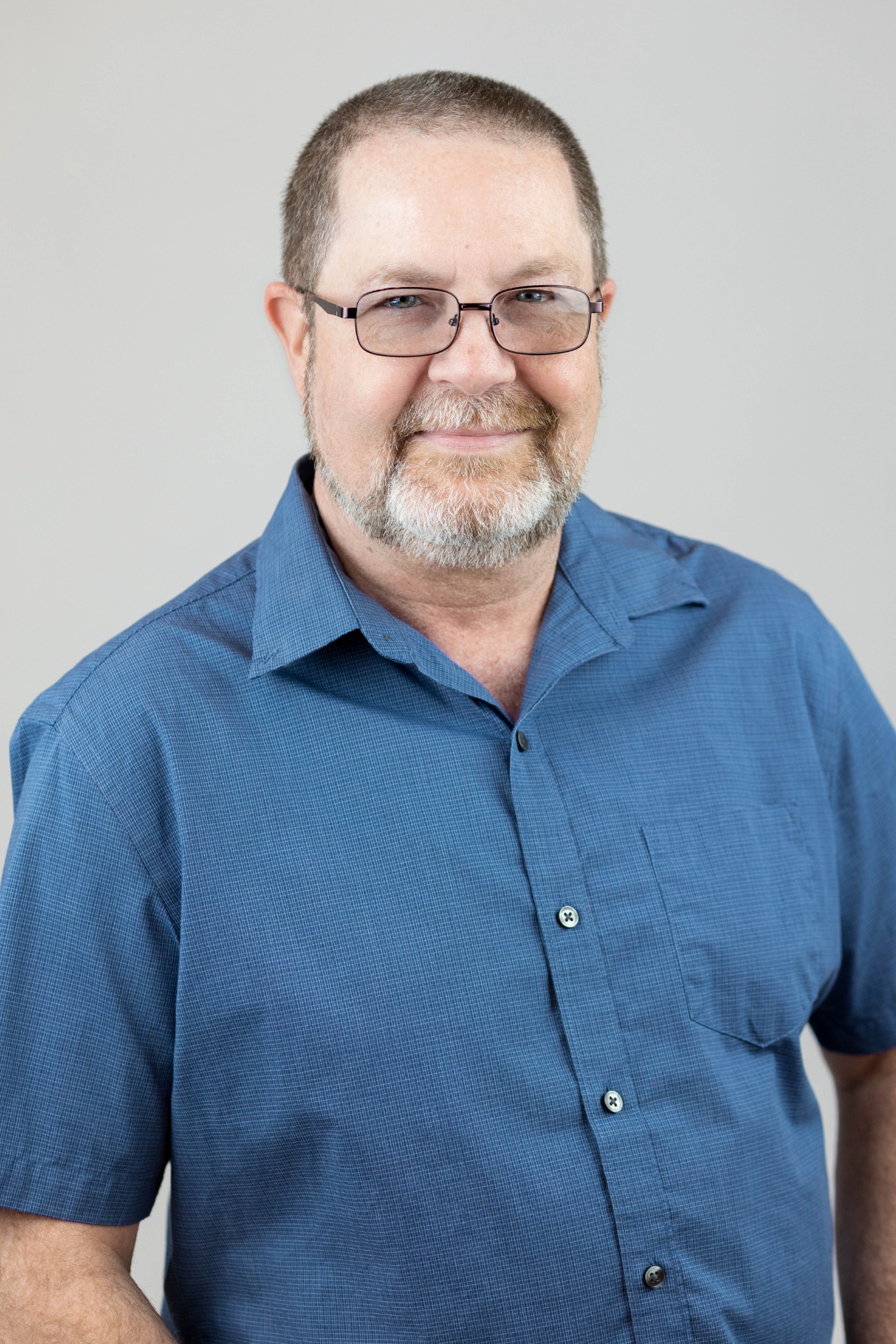 Duane McHodgkins in a blue button-down shirt